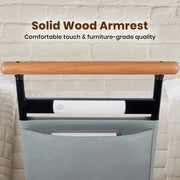 Close-up of solid wood handrail on bed assist rail with built-in safety light and storage pouch